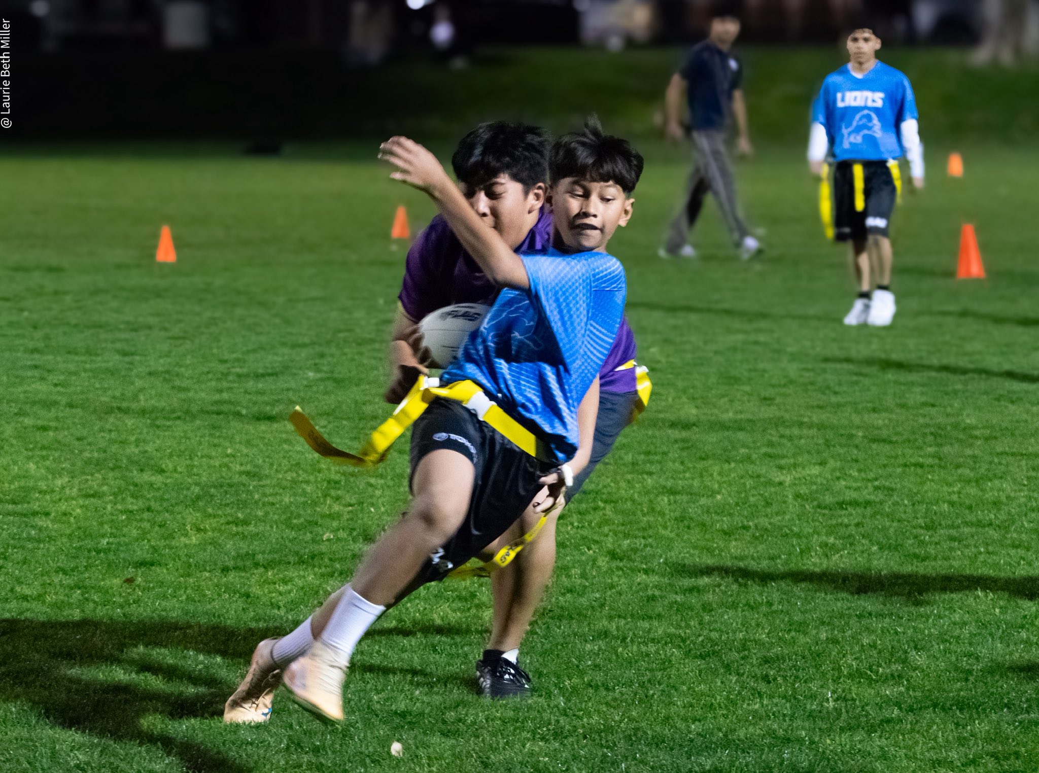 A young NFL FLAG player preparing a pass.